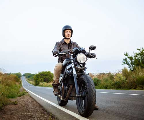 young-handsome-man-riding-motorbike-countryside-road